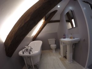 Loft bathroom lit by pure-white LEDs