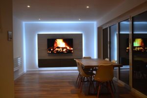 Mounting RGBW LEDs behind a bespoke media panel enhances this TV feature-light's effect