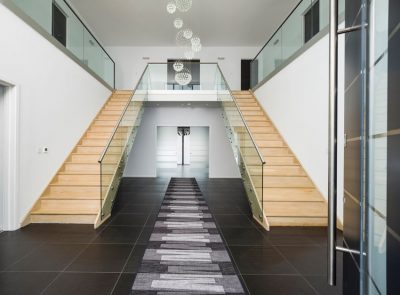 LED strips are installed to uplight the hallway's landing glass guard-panels