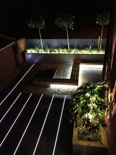 Cool-white LED strips create a contemporary patio